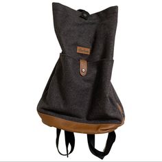 the back pack is made out of canvas and leather