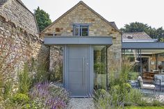 an outside view of a house with stone walls