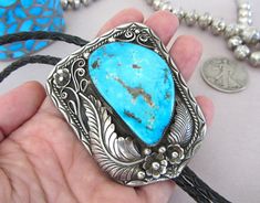 "Hello and thanks for looking! For sale is this LARGE, BLUE, BLUE, BLUE Diné turquoise bolo! The sterling setting were the stone is, is 2.75\" on longest dimension and the sterling tips are 2 5/16th\" long to bottom tiny circular tip on bench beads. The HUGE stone is 1 13/16ths\" on longest side and is of a rich, bright blue with pyrite inclusions and sprinkles, just like Morenci Mine specimens. The back is signed by the Diné artist \"RBP\" and it has the standard \"Bennett Patent Pending\" stam Southwestern Blue Turquoise Necklace With Concho, Southwestern Blue Concho Jewelry, Blue Southwestern Jewelry With Concho, Southwestern Style Blue Concho Jewelry, Blue Turquoise Concho Necklace As A Gift, Southwestern Blue Bolo Ties As A Gift, Southwestern Blue Bolo Tie For Gift, Traditional Blue Concho Jewelry, Western Style Blue Turquoise Collectible Necklace