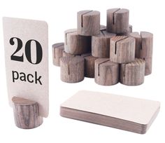 the wooden blocks are next to each other with numbers printed on them, along with a card holder