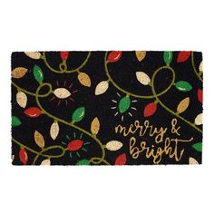 a merry and bright door mat with leaves on it