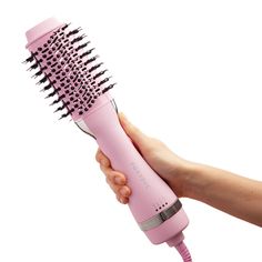 Say hello to our best-selling Blowout Dryer Brush in Party Pink, the ultimate hair essential to give you salon-quality blowouts wherever you go! This all-in-1 dryer brush detangles, dries, and styles hair in one easy step and only half the time! Its sleek ceramic-coated barrel styles hair with ease, while protecting your tresses from heat damage and adding a healthy shine. Dual bristles detangle effortlessly and help carry your hair's natural oils from root to tip, creating silky smooth strands Hair Blowout Tool, Travel Blow Dryer, Titanium Flat Iron, Rose Gold Flats, Dryer Brush, Hydrating Hair Mask, Scalp Serum, Natural Hair Oils, Blowout Hair