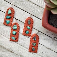 Earrings are handmade by me in Utah from quality polymer clay and hardware. Made with real turquoise tumbles stones and are 2 inches long and 3/4 inch wide. Two to choose frome and ready to ship. Terra Cotta Clay Earrings, Handmade Southwestern Green Earrings, Bohemian Hand-tooled Drop Earrings, Bohemian Turquoise Hand-tooled Earrings, Artisan Hand Tooled Drop Earrings, Artisan Hand-tooled Drop Earrings, Unique Clay Dangle Jewelry, Nickel-free Turquoise Jewelry For Crafting, Earthy Turquoise Dangle Jewelry