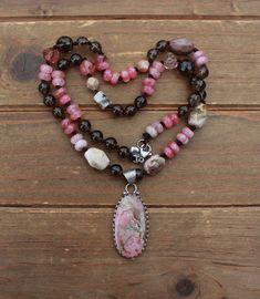 Bohemian Pink Agate Necklace, Pink Tourmaline Bohemian Jewelry, Pink Bohemian Beaded Pendant Necklaces, Handmade Pink Tourmaline Necklaces, Handmade Pink Tourmaline Necklace, Bohemian Rhodonite Jewelry With Natural Stones, Necklace With Pendant, Beaded Necklaces, Beaded Necklace