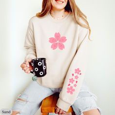 Sakura Sleeve Print Sweatshirt, Sakura Shirt, Cherry Blossom Shirt, Kawaii Shirt, Aesthetic Flowers Sleeve Print Sweatshirt, Cherry Blossom Gildan 18000 Sweatshirt 💝 PRODUCT DETAILS 💝 - 50% cotton, 50% polyester - Medium-heavy fabric (8.0 oz/yd² (271.25 g/m - Loose fit - Sewn-in label - Runs true to size 💝 CARE INSTRUCTIONS 💝 - Machine wash: cold (max 30C or 90F) - Non-chlorine: bleach as needed - Tumble dry: low heat - Do not iron directly on design - Do not dryclean Gildan 18500 Hoodie 💝 Spring Kawaii Long Sleeve Sweatshirt, Kawaii Long Sleeve Sweatshirt For Spring, Spring Long Sleeve Kawaii Sweatshirt, Pink Casual Sweatshirt With Floral Print, Pink Floral Print Casual Sweatshirt, Casual Pink Floral Print Sweatshirt, Trendy Long Sleeve Floral Print T-shirt, Trendy Long Sleeve Floral T-shirt, Kawaii Long Sleeve Tops For Spring