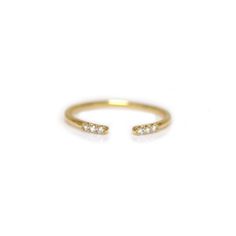 This minimalistic stacking talon ring is incredibly effortless and can be easily added to any stack. Its versatile open design nests well with both sleek and chunky pieces, making it your new favorite go-to. Try stacking this open diamond ring with our Golden Grace Twist ring and Alinea ring for a modern yet subtle look. Custom 1/2 and 1/4 sizes are available for a $25 resizing fee. Please put your size request in the notes section during online checkout. To order this piece in a different metal Open Diamond Ring, Twist Ring, Rings Cool, Open Design, Pink Bracelet, Jewelry Cleaner, White Ring, White Diamonds, 14kt Gold