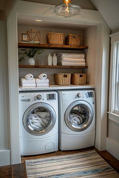 a washer and dryer in a small room with open shelving on the wall