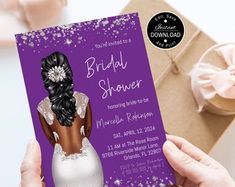 a woman holding up a purple bridal shower card