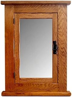 a wooden cabinet with a mirror on it