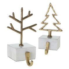 two white and gold christmas trees on hooks