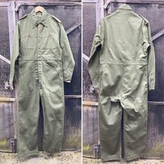 Belgium Vintage Military Overalls, Size M,  Un-worn mechanics Coveralls. Olive green in colour. Lovely heavy weight 100% cotton Wonderful detail and in mint, un-worn condition.  Button closure, and on both cuffs, 2 vertical front pockets, 2 deep waist pockets  Shoulder 19 inches Chest 40 inches Inside leg 30 inches Waist 37 inches  Hips 44 inches Rise 30 inches Leg Bottom 10 inches Please be aware that our vintage items are not new and may have minor imperfections. We try to list all defects. Me Military Style Cotton Overalls, Military Style Long Sleeve Cotton Jumpsuit, Military Style Long Sleeve Cotton Jumpsuits And Rompers, Vintage Cotton Jumpsuits And Rompers For Work, Green Cotton Utility Overalls, Green Long Sleeve Cotton Jumpsuits And Rompers, Green Cotton Long Sleeve Jumpsuit, Green Long Sleeve Cotton Jumpsuit, Military Style Green Overalls With Pockets