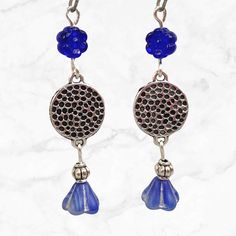 Cobalt blue earrings with silver accents. Deep blue beads contrast beautifully against silver. These long beaded earrings are lightweight and comfortable for daily wear.  Hypoallergenic ear wires (nickel and lead free). Select ear wire style at checkout. Artisan glass beads produced in small quantities in the Czech Republic. A gift for you or someone special, earrings are carded and in an organza bag. More of my silver earrings: https://www.etsy.com/shop/JezaJewelry?ref=simple-shop-header-name&l Handmade Blue Beaded Metal Earrings, Blue Metal Beaded Drop Earrings, Nickel-free Czech Glass Flower Dangle Earrings, Nickel-free Czech Glass Dangle Earrings, Blue Metal Beaded Dangle Earrings, Blue Metal Beaded Earrings For Pierced Ears, Blue Sterling Silver Flower Earrings For Pierced Ears, Blue Flower Earrings Nickel Free, Blue Flower-shaped Sterling Silver Earrings