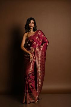 This handwoven wine red Banarasi saree, crafted from luxurious Mashru satin silk, features intricate Minakari work. Perfect for special occasions, this saree is designed to elevate your style. Designer Red Paithani Silk Pre-draped Saree, Formal Festive Dola Silk Saree, Formal Unstitched Dola Silk Saree, Formal Dola Silk Saree With Pallu, Formal Art Silk Saree With Motifs, Formal Silk Saree With Motifs, Formal Saree With Motifs, Designer Red Paithani Silk Traditional Wear, Red Pre-draped Saree With Zari Weaving In Jamawar