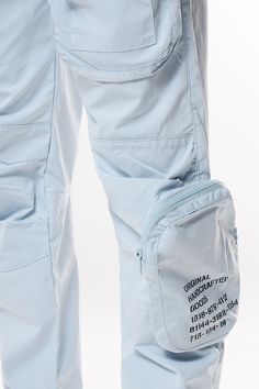 Details Open Bottom Jogger Color: Seabreeze Material: 100% Polyester Style: WP23182 Summer Sports Parachute Pants With Pockets, Blue Nylon Bottoms With Functional Pockets, Casual White Bottoms With Functional Pockets, White Nylon Parachute Pants For Summer, Casual Blue Bottoms With Functional Pockets, Casual Blue Pants With Functional Pockets, White Parachute Pants With Pockets For Outdoor Activities, White Bottoms For Outdoor Activities In Spring, White Bottoms For Spring Outdoor Activities