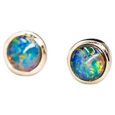 Minimalist Round Shaped Australian Triplet Opal Stud Earrings 14K Yellow Gold. Free Domestic USPS First Class Shipping!  Free One Year Limited Warranty!  Free Gift Bag or Box with every order! Opal—the queen of gemstones, is one of the most beautiful and rarest gemstones on earth.  Every piece of opals has its colors and patterns, which is perfect for designers to create unique engagement rings for someone extra special.  We use 100% Natural & Ethically opal stones (NO synthetics or imitations) Yellow Gold Round Opal Jewelry, Yellow Gold Opal Jewelry In Round Shape, Gold Opal Multi-stone Jewelry, Rarest Gemstones, Luxury Yellow Gold Opal Earrings, Gold Opal Cabochon Earrings, Opal Stud Earrings, Opal Earrings Stud, Opal Studs