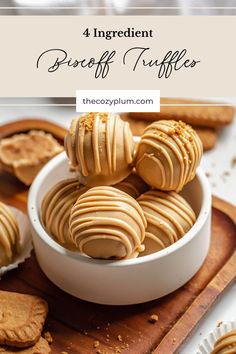 peanut butter truffles in a white bowl on a wooden cutting board with cookies