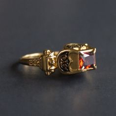 Massive Renaissance ring with enamel. This ring shape was pretty popular in 16th century Western Europe. Brass or silver cast, gold plating, cold enamel, CZ garnet. Available stone colors: red, purple, green, blue, light blue, black, transparent (diamond). Please point out the desirable stone color in the notes to your order. Weight 11 g. Please note that this ring is quite massive and we cannot make it less than 7 3/4US / 18DE size. Antique Enamel Ring Jewelry, Victorian Enamel Ring Jewelry, Classic Gold Enamel Ring With Gemstone, Heirloom Enamel Ring Jewelry, Heirloom Enamel Ring, Elegant Enamel Signet Ring As Gift, Gothic Gold Rings For Anniversary, Classic Enamel Ring Jewelry, Vintage Gold Jeweled Rings