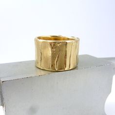 "Wide Bronze Ring, Rustic Bronze Ring, Boho Wide Gold Ring, Ancient Bronze Ring, Wide Gold Ring, \"Cakewalk Ring\" Multiple layers of bronze are used to create this unique surface texture Width is approximately 1/2 inch or a little more with organic edges Every ring is handmade. All of my rings are one of a kind and unique works of art. Each ring is unique and will be similar to the images but may vary slightly in width and pattern. Each ring has its own character with organic edges, undulating Wide Band Hand Cast Rings For Anniversary, Adjustable Thick Band Stackable Wide Ring, Gold Wide Band Stackable Rings Gift, Anniversary Rings With Hand Cast Wide Band, Anniversary Hand Cast Wide Band Rings, Artisan Hand Cast Adjustable Ring, Artisan Wide Band Jewelry As Gift, Unique Thick Band Rings For Gift, Hand Cast Wide Band Jewelry Gift