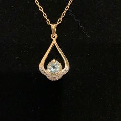 2 Ct Blue Topaz & Diamond Accent Pendant 22kt Nib Bought At Estate Sales Says 22kt Gold/Brass Gold Aquamarine Jewelry With Accent Stones, Elegant Gold Necklace With Accent Stones, Elegant Gold Necklaces With Accent Stones, Gold Aquamarine Jewelry With Gemstone Accents, Gold Necklaces With Accent Stones For Formal Occasions, Gold Jewelry With Diamond-cut Blue Topaz, Gold Blue Topaz Jewelry With Diamond Cut, Gold Blue Topaz Teardrop Pendant, Round Aquamarine Gold Jewelry