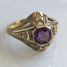 Details: Victorian 14K gold Art Deco amethyst ring circa 1930's. Beautiful deco design, with leaf inspired pattern. The lovely amethyst measures 6.7mm x 6.7mm, and sits about 5.5mm from the finger. The setting measures 15.4mm from top to bottom. The ring is in excellent condition. Please ask all necessary questions prior to placing an order. Measurements: The size is 7 US and can be sized for a fee. Condition: The overall all condition of this ring is excellent condition and the stone is securel Antique Yellow Gold Signet Ring With Gemstone, Art Deco Purple Amethyst Ring For Formal Occasions, Art Deco Yellow Gold Ruby Ring For Formal Events, Purple Amethyst Art Deco Ring For Formal Occasions, Victorian Gemstone Signet Ring For Formal Events, Victorian Gemstone Signet Ring For Formal Occasions, Formal Art Deco Ruby Ring In Yellow Gold, Purple Amethyst Hallmarked Signet Ring, Elegant Purple Amethyst Signet Ring