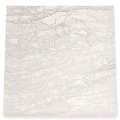 a white marble tile with cracks in it