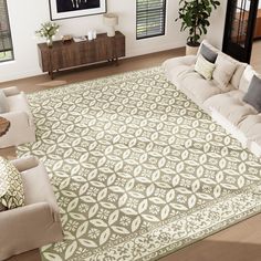 a living room filled with furniture and a large rug on top of a hard wood floor