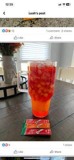 a cup filled with liquid sitting on top of a wooden table