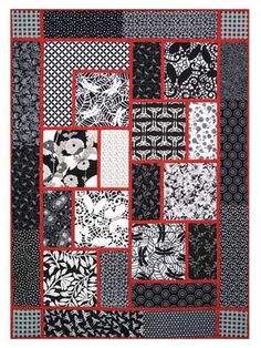 a black and white quilt with red border