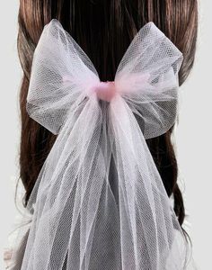 Perfectly pink! A sweet alternative to the wedding veil, the tulle bow! These romantic tulle bows add just a little wedding tradition to your ensemble without all the fuss of the full veil. Cute, a little glam, and very modern! The bows are handmade to order and cut from the softest tulle, they attach with an organza-wrapped metal comb.  The purchase of this listing is for one tulle hair bow:  Style: Tulle veil bow Measurements from top of comb - 15" - Bow measures 5" wide Attachment: 4" x 1.5" Full Veil, Hair Bow Style, Headpiece Veil, Veil Bow, Tulle Hair Bow, Veil Alternative, Black Hair Comb, Bridal Bow, Tulle Hair Bows