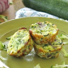 two muffins sitting on top of a green plate