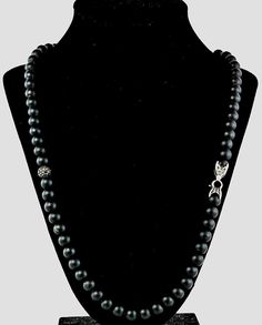 "A diamond \"Spiritual bead\" necklace from jewellery designer David Yurmam. Featuring a string of black Onyx beads and pave diamond bead on a sterling silver box link chain. A pave diamond set bead sits mid length and has approximately 0.90ct of black diamonds. Length 22.5 inches. Very good pre owned condition. Hallmarked on clasp with designers logo. Original Price £3800 Please ask should you have any further questions." Luxury Silver Beaded Necklaces, Elegant Hand-strung Sterling Silver Necklaces, Luxury Hand-strung Silver Jewelry, Spiritual Black Jewelry With Polished Beads, Luxury Black Necklace With Polished Beads, Luxury Black Polished Beads Jewelry, Luxury Black Polished Bead Jewelry, Luxury Black Jewelry With Polished Beads, Black Hand-strung Jewelry With Round Beads