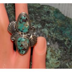 For your consideration is this spectacular large statement Native American Navajo sterling silver and Kingman turquoise ring size 6.5 by the well known Navajo artist Chris Etsitty. This phenomenal ring features an intricately hand etched, detailed traditional Navajo squash blossom design of 2 beautiful Kingman turquoise stones set in sterling silver. Exceptional craftsmanship and attention detail. The ring is signed by the artist. The ring is size 6.5. The front of the ring measures impressive 1 3/4" tall by 1 1/4 wide. Stunning example of wearable, collectible Native American art to add to any collection! Bohemian Engraved Turquoise Ring In Sterling Silver, Artisan Engraved Turquoise Ring Collectible, Turquoise Statement Ring, Vintage Native American Jewelry, Native American Necklace, Native American Rings, Navajo Turquoise, Squash Blossom, Blossom Design