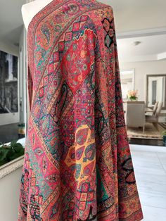 The Shahjahan Kani Pashmina Shawl is a luxurious woven textile inspired by the opulent aesthetic of the Mughal era, particularly the reign of Emperor Shah Jahan. Crafted in the Kashmir region using the traditional Kani weaving technique, this shawl features intricate, elaborate patterns and motifs, often including florals and paisleys. Made from the finest Pashmina wool, the shawl is celebrated for its exceptional softness, warmth, and exquisite craftsmanship. It represents a blend of historical Opulent Aesthetic, Shah Jahan, Pashmina Shawl, Weaving Techniques, Shawls And Wraps, Reign, Scarf Wrap, Scarf Accessory, Shawl