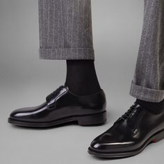 Men’s polished black leather Derby shoe: buy on Santoni Shoes Official Boutique, luxury handcrafted shoes and accessories since 1975. Black Luxury Oxfords With Rubber Heel Cap, Luxury Black Oxfords With Rubber Heel Cap, Black Calf Leather Oxfords With Leather Sole, Luxury Goodyear Welted Oxfords With Round Toe, Luxury Goodyear Welted Round Toe Oxfords, Sleek Patent Leather Dress Shoes With Round Toe, Black Calf Leather Almond Toe Shoes, Black Almond Toe Calf Leather Shoes, Classic Black Monk Strap Shoes With Brogue Detailing