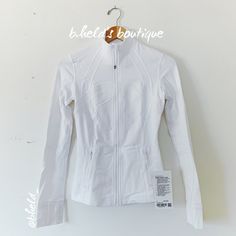 Description: Lululemon Define Jacket *Luon In White (Wht). Pristine True White Color. 2022 Older Style. Special Collector’s Item. Has An Elastic Zipper Pull (Or Hair Tie) Attached To The Front Zipper. Up For Adventure. And Ready For Downtime. Made From Cottony-Soft Luon Fabric. Zippered Pockets. Has Thumbholes & Cuffins. Slim Fit, Hip Length. Sold Out. Size: Size 4 Condition: Brand New With Tags (Nwt). Never Worn! Authentic Lululemon Purchased Directly From The Lululemon Website. About B.Held’s White Long Sleeve Outerwear For Workout, White Stretch Sports Outerwear, White Stretch Outerwear For Sports, White Spring Workout Outerwear, Sporty White Outerwear For Workout, White Fitted Functional Outerwear, Fitted Functional White Outerwear, White Outerwear For Spring Workout, Functional White Fitted Outerwear