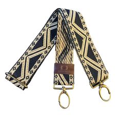 Black And Beige Ethnic African Bag Strap. This strap goes really well with both black, beige and cream bags. We provide the snap hooks in olde gold... shoul you wish silver snap hooks, please let us know! Old gold snap hooks... should you wish silver finishing, please let us know! Beige Rectangular Bag Strap With Gold-tone Hardware, Beige Bag Strap With Gold-tone Hardware For Travel, Beige Bag Strap With Gold-tone Hardware For Everyday Use, Gold Adjustable Shoulder Bag For Everyday Use, Adjustable Gold Bag Strap For Travel, Travel Bag With Gold-tone Hardware And Adjustable Strap, Gold Bag Strap With Metal Hardware For Everyday Use, Adjustable Gold Bag Strap For Daily Use, Adjustable Gold Shoulder Strap For Travel