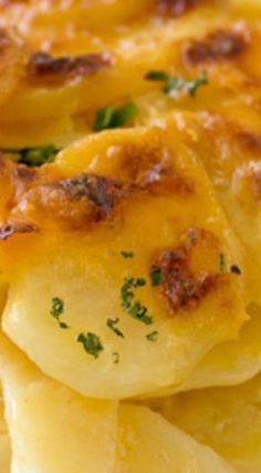 a close up view of some food with cheese and parmesan on the top