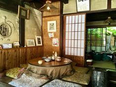 a room with wood paneling and pictures on the wall