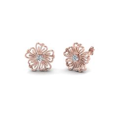 The Hibiscus Nature Inspired Earring For Women unfolds an aesthetic round shaped diamond with impeccable sparkle held in the center in a classic progn setting highlighted with an artistic hibiscus flower design created with perfection offering you an enthralling look. Round cut diamonds of 0.10 Total Carat Weight with Clarity SI2 and Color G studded in a prong setting.                                   &nbs Hibiscus Flower Design, Emerald Earrings Studs, Round Flower, Sapphire Solitaire, Fancy Earrings, Jewelry Simple, Earring For Women, Flower Stud, Hibiscus Flower