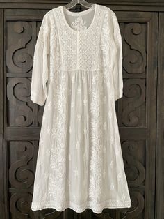 Chikan Kari Kurti Designs, Transitional White Dress With Intricate Embroidery, Long White Festive Dress, Festive Long White Dress, Fitted Chikankari Embroidery Dress For Transitional Season, Bohemian Dresses With Chikankari Embroidery For Transitional Season, White Anarkali Dress For Eid, White Fitted Anarkali Dress, Traditional Off White Dress With Resham Embroidery