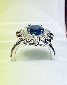 Beautiful 14k White Gold Natural Sapphire and Diamond Ring : Natural Sapphire: 3.12 CT Side Diamonds: 0.50CT Color: G Clarity: SI1 Total ring weight: 6.2GR 14K White Gold Free Ring sizing available For more information regarding this item feel free to reach me so I can accommodate your needs. Thank you Platinum Marquise Cut Gemstone Rings, Formal White Gold Flower Ring In 14k, Formal 14k White Gold Flower Ring, Round Diamond Cut Sapphire Ring, Fine Jewelry, Fine Jewelry Round Sapphire Diamond Cut Ring, Silver Emerald Ring With Brilliant Cut In Cluster Shape, Silver Emerald Ring With Brilliant Cut Cluster, 14k White Gold Pear-shaped Jewelry For Anniversary, Platinum Emerald Ring With Hallmark