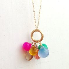 This gemstone necklace created by Jewelry by Carmal is made of a pink, yellow, periwinkle, grapefruit chalcedony, purple cz, ametrine and chrysoprase gemstones, 14K gold filled: chain, spring ring clasp and findings. This necklace measures 24 inches in length. Create a mother's necklace by selecting birthstones for you and your siblings! All of our jewelry arrives wrapped and ready for gift giving. We offer free standard shipping, via USPS, within the United States. Gift Chalcedony Faceted Necklaces, Pink Multi-stone Necklaces For Gifts, Pink Multi-stone Necklace As Gift, Pink Multi-stone Necklace For Gift, Shiny Rocks, Geode Jewelry, Sugar Land, Jewellery Inspiration, Cluster Necklace