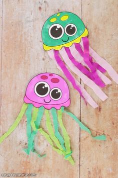 paper plate jellyfish craft for kids with googly eyes on the top and bottom