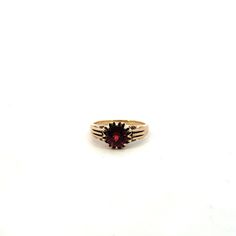 Featuring our antique-style 2.0 carat garnet ring set in 14K yellow gold. Metal: 14k (karat) yellow gold Stone: 2.0 carat round cut garnet Size: 6.25 US / M UK / 52.5 EU Weight: 2.9Dwt (pennyweight) Style: antique style Condition: gently preowned and professionally cleaned and polish by our in-house jeweler. Gold Garnet Ring, Garnet Ring, Gold Stone, Garnet Rings, Antique Style, Rings Statement, Ring Set, Ring Sets, Round Cut