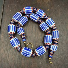 Antique Venetian Inspired African Blue Chevron, wedding cake Beads Necklace BG-6 Other Names Chevron Beads SIX Layer Type of Object Drawn, multi-layered glass Color BLUE, RED, White  Approximate Age Late 20th century Overall  * Condition: Good to fair.  * See picture with Size measurement tool for size comparison.  * Strand Length24 inches * Brand: Unbranded  * Style: Beaded  * Type: Necklace Additional information: Venetian Chevron beads are the most beautiful, recognizable and colle Layer Art, Chevron Beads, Millefiori Beads, African Beads Necklace, Star Mold, Chevron Wedding, Stone Necklaces, Object Drawing, Blue Chevron