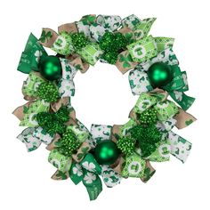 Add a whimsical touch to your St. Patrick's Day decorations with this fun ribbon wreath. Shamrock and leprechaun hat ribbons surround glittery shamrocks and green ornaments. Perfect on doors walls or mantles. Features: Green and white festive ribbons Glittered shamrocks with green ball ornaments Recommended for indoor use only - if using outdoors place under a covered area No assembly required - wreath comes in 1 piece Dimensions: 24" diameter (measured from outermost edge to outermost edge acro Green Ornaments, Fall Floral Decor, Leprechaun Hat, Material Wreaths, Leprechaun Hats, St Patrick's Day Decorations, Wreaths And Garlands, Artificial Wreath, Christmas Central