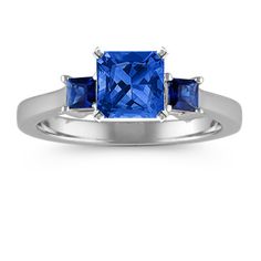 three stone blue sapphire ring in white gold