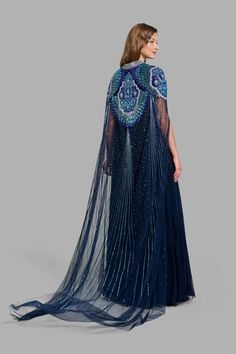 This princess-like Peacock Dress in tulle is carefully crafted with floral patterns and it’s design is further enhanced with embroidered sequins and bugle beads Free worldwide shipping! CURRENTLY 40% OFF Party Dresses With Intricate Embroidery And Tulle, Party Dress With Intricate Tulle Embroidery, Party Tulle Dress With Intricate Embroidery, Embroidered Evening Dress With Cape Sleeves, Evening Dress With Embroidery And Cape Sleeves, Evening Dress With Embroidered Cape Sleeves, Embroidered Tulle Evening Dress, Embellished Tulle Dresses For Receptions, Embellished Tulle Dress For Reception