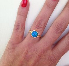 Blue ring Yellow Gold Opal Ring With Round Stone As Gift, Gold Opal Stackable Rings Gift, Gold Opal Ring In Sterling Silver, Gold Opal Ring With Round Stone For Gift, Gold Opal Ring With Round Stone, Gold Solitaire Opal Ring, Gold Solitaire Opal Ring As Gift, Gift Opal Ring With Bezel Setting And Round Stone, Gift Opal Ring With Bezel Setting