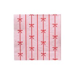 a pink napkin with red bows on it